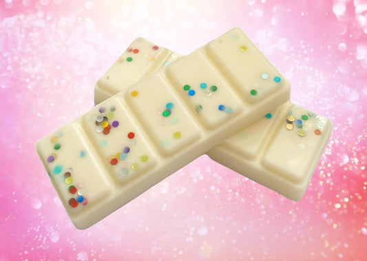 A snap bar with multiple sections, each section Infused with a different scent, and adorned with colorful sprinkles on a white background.