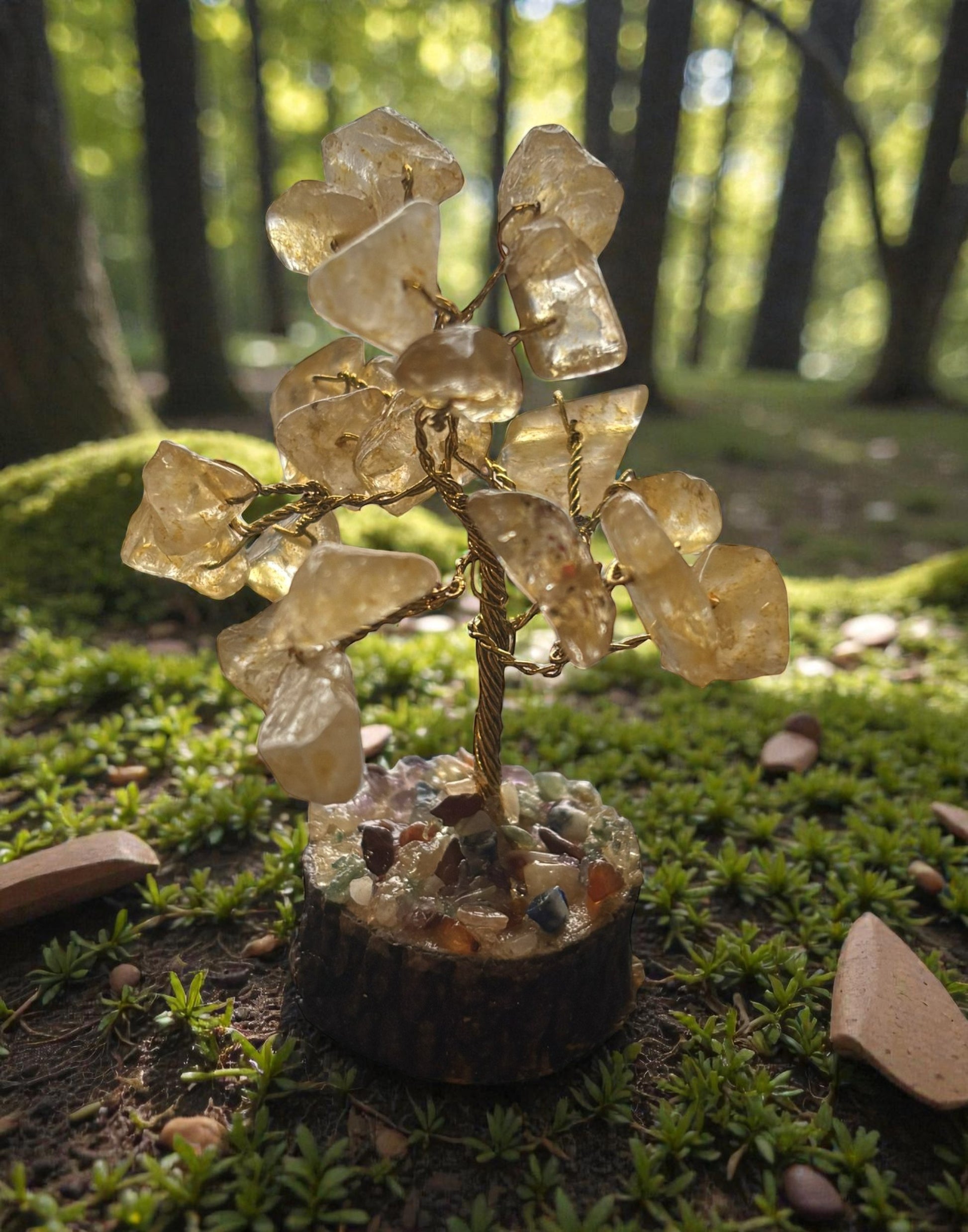 Crystal tree sculpture on a natural background with greenery
