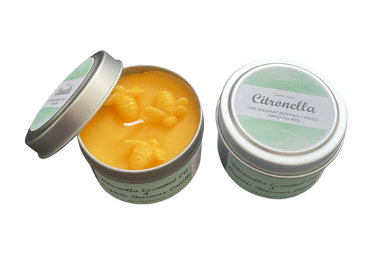Two Citronella candles in tins on a white background