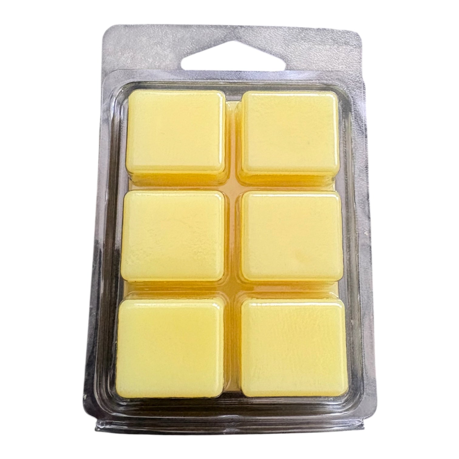 Six pale yellow wax melts in a clear plastic clamshell package with a silver-gray backing card and hanging tab, shown on a white background.