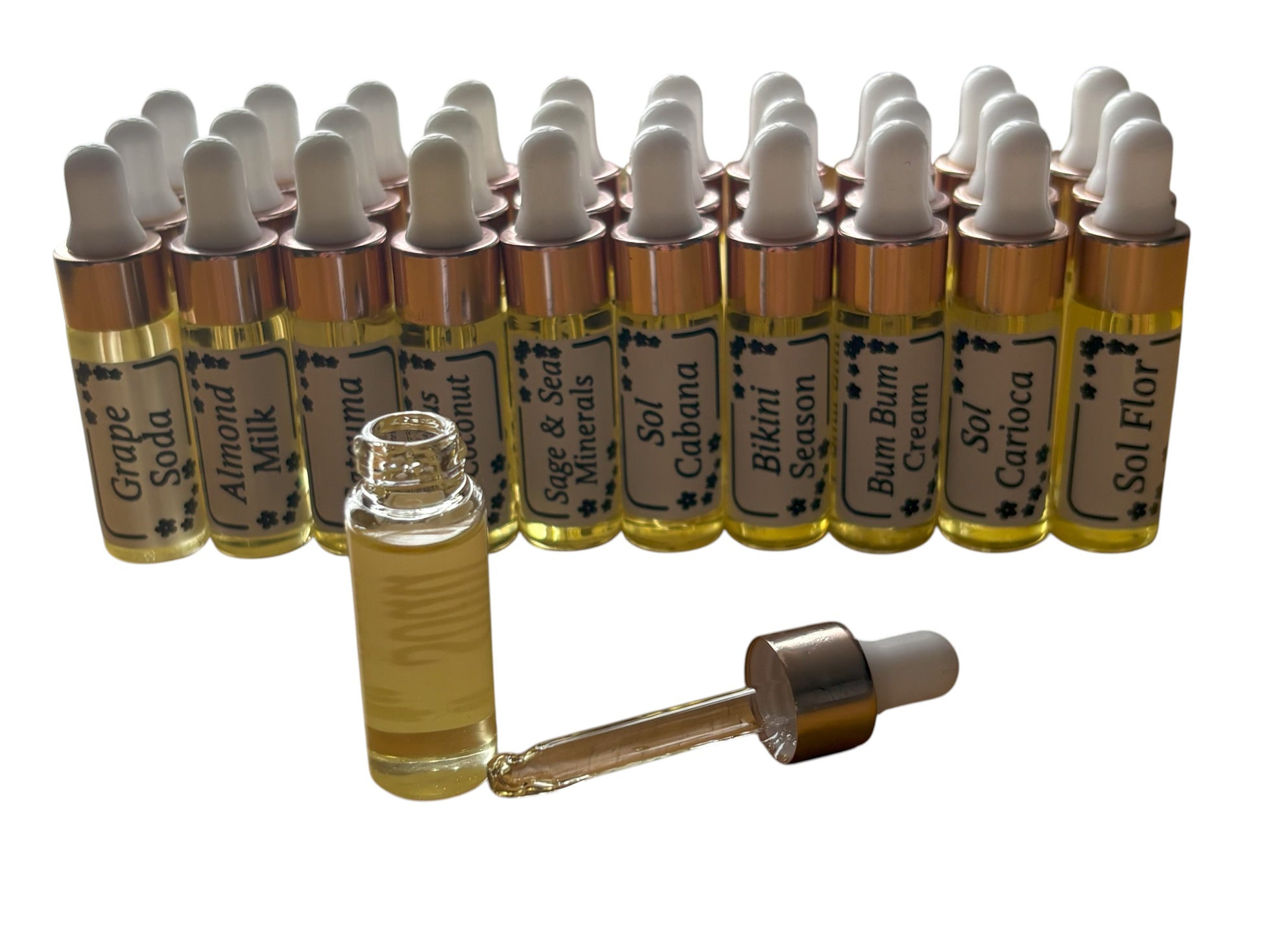 Collection of small glass bottles with droppers and labels on a white background