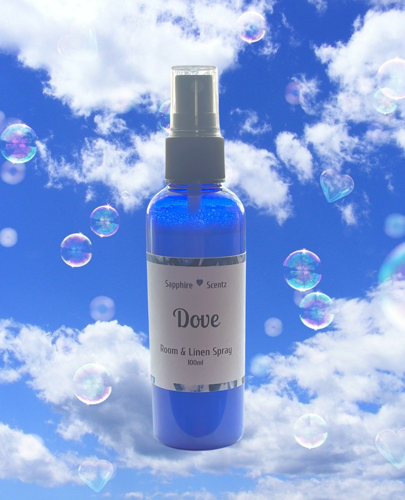 A blue 100ml pump action bottle of Dove room and linen spray, with bubbles in the background, against a cloudy sky.