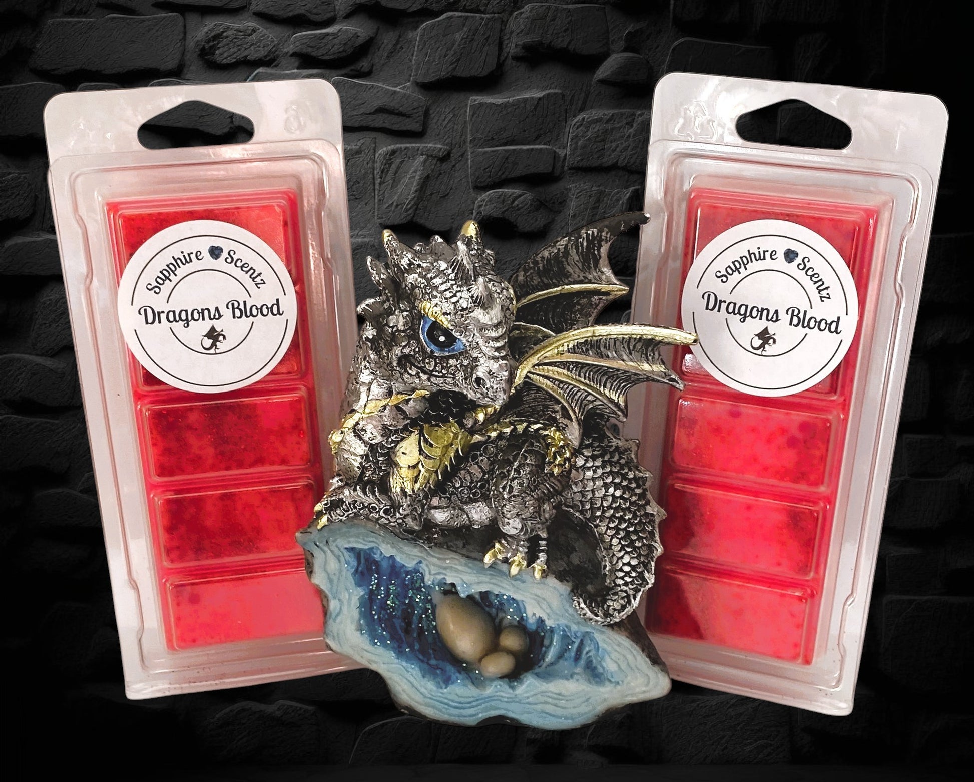 A wax snap bar with a decorative dragon figure on top, labeled 'Dragons Blood'.