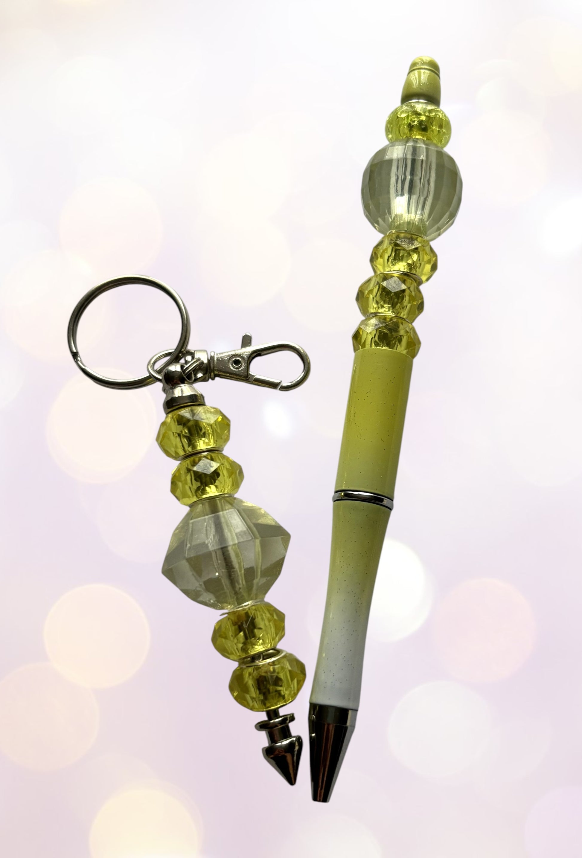 Beaded pen and keychain set with a soft focus background