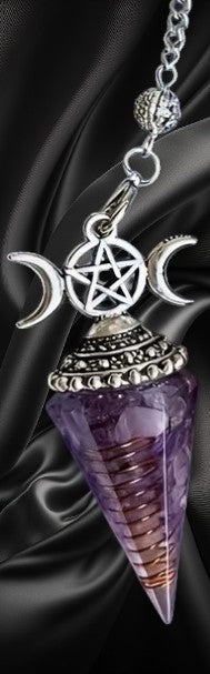 Amethyst crystal necklace with pentagram and moon symbol on a dark fabric background