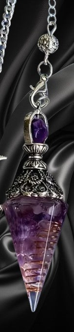 Purple amethyst crystal pendant with silver chain on a dark background