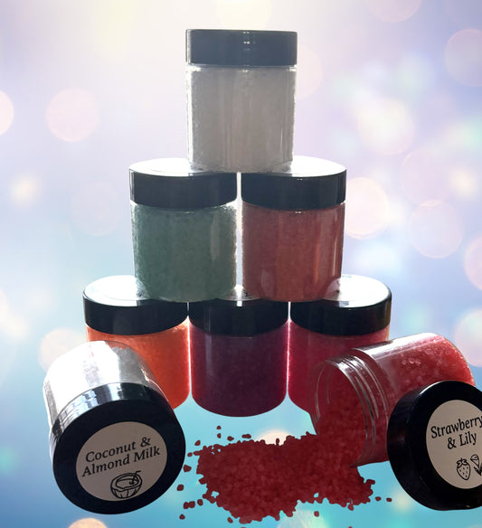 Stack of small jars with black lids on a blurred background