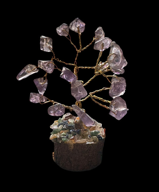 Crystal tree with purple and clear crystals on a dark background